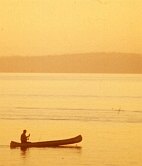 Photo of a canoe ride at sunset